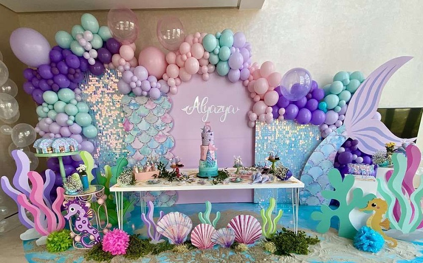 Mermaid candy table decoration with balloons