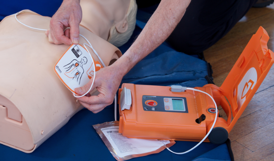 What is a defibrillator and when is it used?