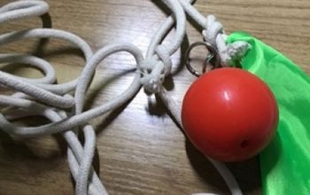 Suzakoo rubber exercise ball attached with rope for striking practice.