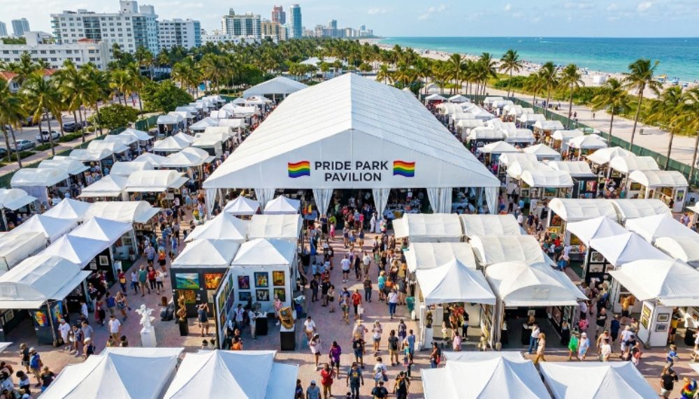 Aerial view of Pride Park pavilion tent at Miami Beach during the fair with visitors exploring gallery booths