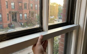 Tight wooden window frame repair in Boston home