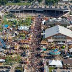 Aerial view of the Iowa State Fair 2026 grounds in Des Moines with crowds and fairground rides