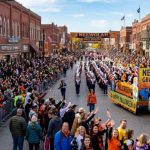 Thousands of spectators lining the streets of downtown Independence, Kansas, to watch the Neewollah Grand Parade on Halloween morning 2026