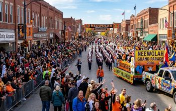 Thousands of spectators lining the streets of downtown Independence, Kansas, to watch the Neewollah Grand Parade on Halloween morning 2026