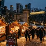 Wooden holiday market stalls decorated with lights near Central Park entrance
