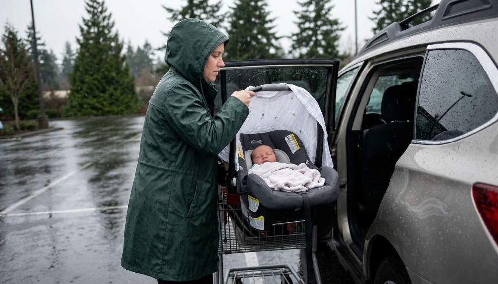 Newborn protected in stroller during Seattle rain