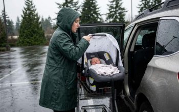 Newborn protected in stroller during Seattle rain