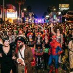 Crowd in costumes at West Hollywood Halloween Carnaval street party