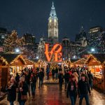 Christmas Village Philadelphia 2026 at LOVE Park with wooden vendor booths and holiday lights at night