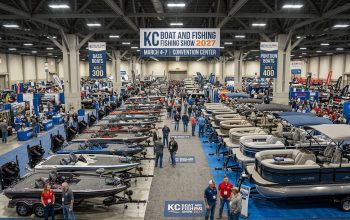 Rows of bass boats and pontoon boats on display at the KC Boat and Fishing Show 2027 indoor exhibit hall