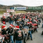 Motorcycle riders in Santa hats gathered at Road Atlanta for the Santa Toy Run 2026 toy drive event in December